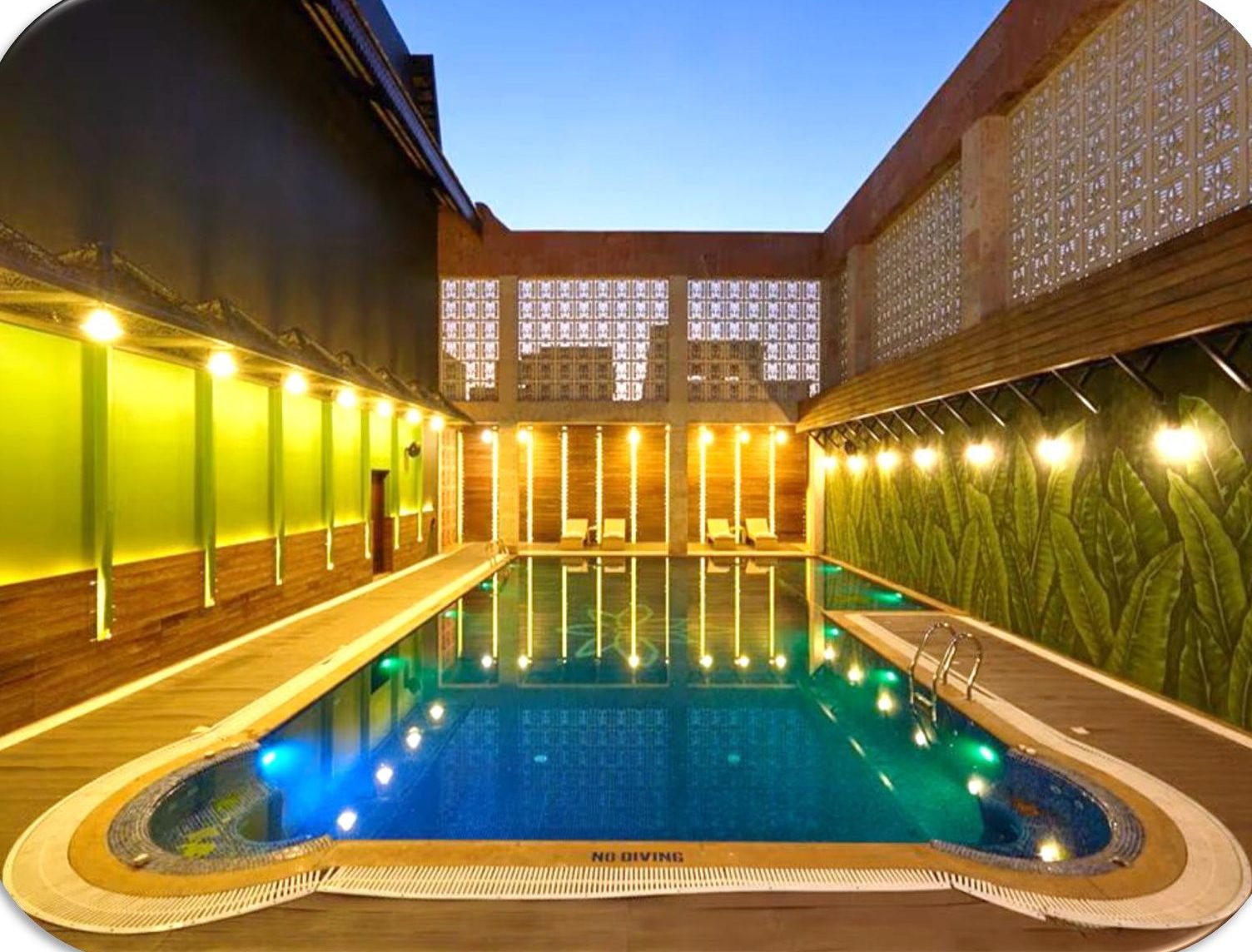 Club Anandam — poolside at dusk